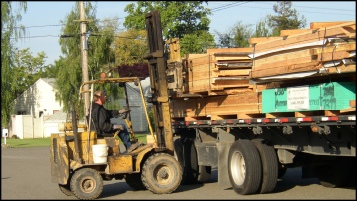 Forklift unloading PMHI Wall Panels. Picture Courtesy California Precut Homes