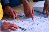 click to view our plans Contractor reviewing home plans