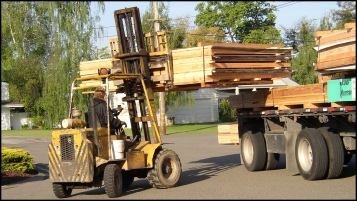 Forklift Unloading PMHI Wall Panels at Jobsite. Picture Courtesy California Precut Homes 